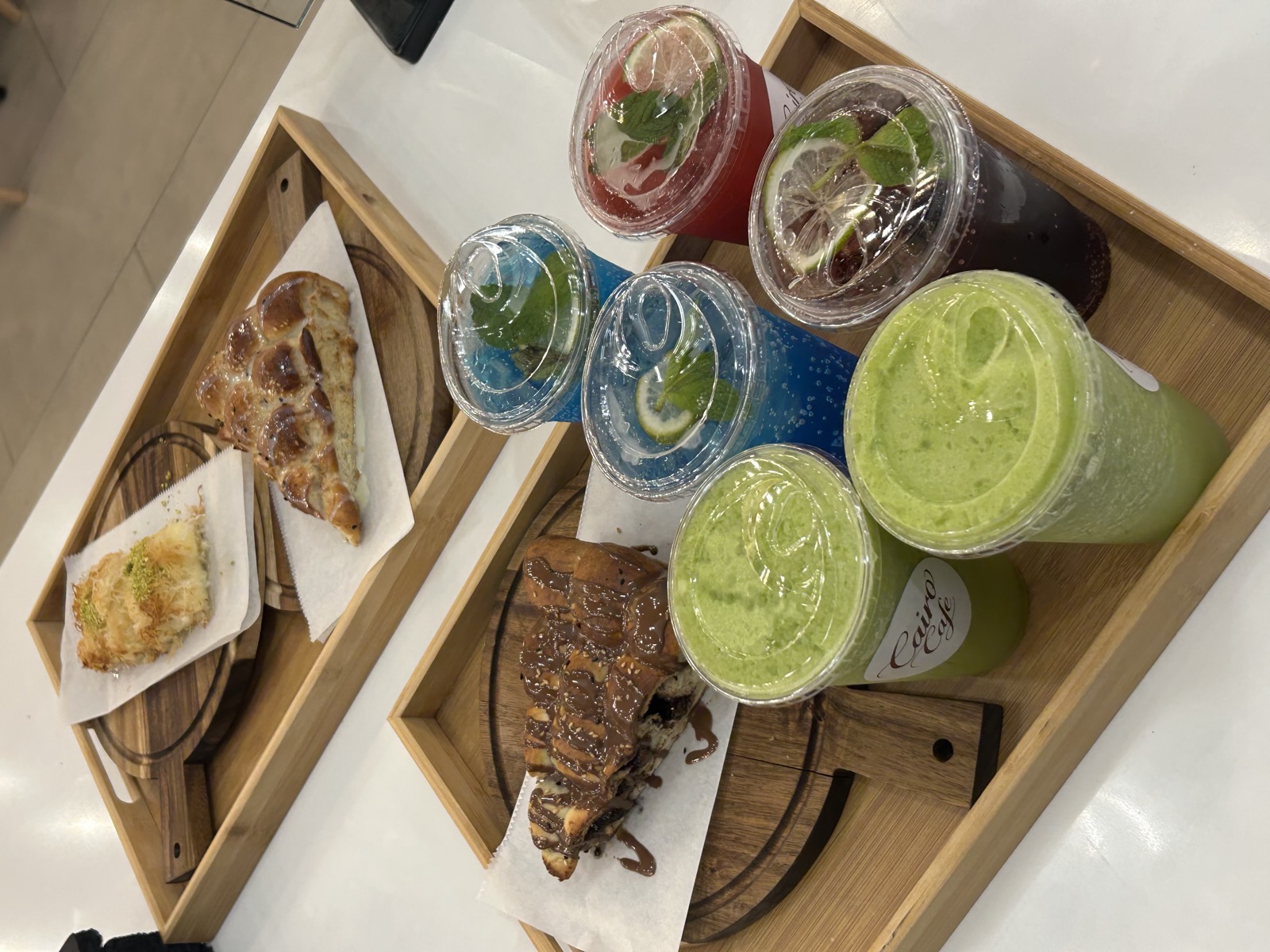 Trays of kunafa, feteer and iced drinks